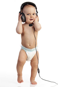 Cute one-year old boy in a headset against white-178389538